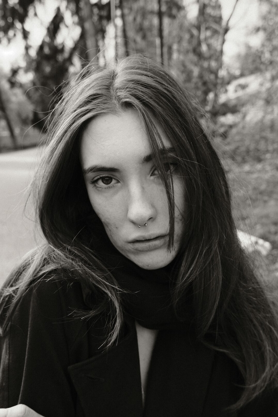Portrait of a woman with long hair looking at the camera