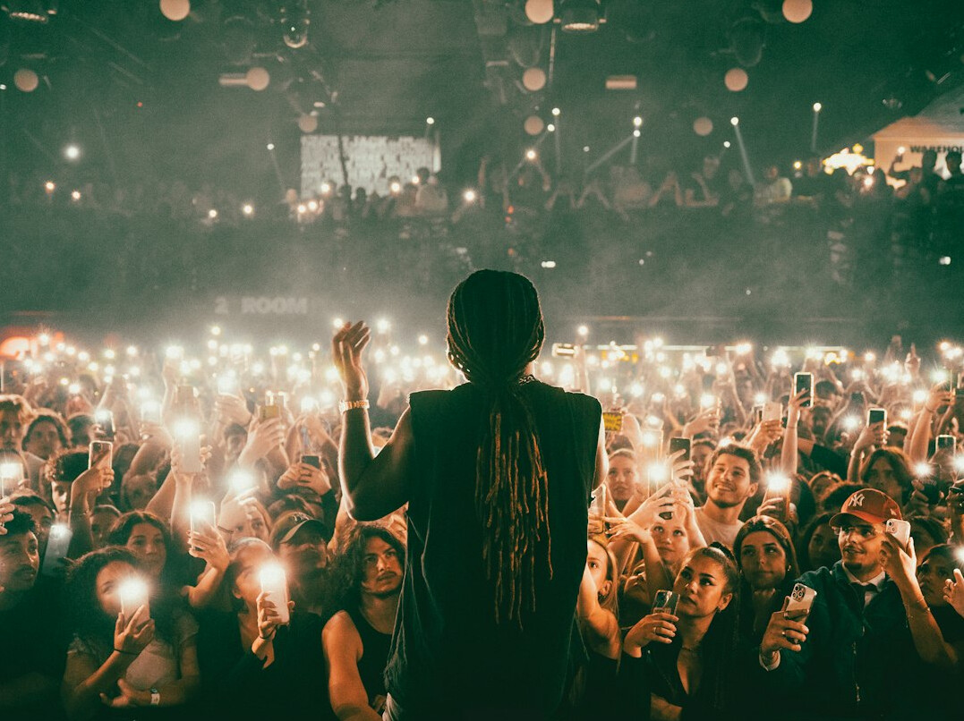Presenter on stage in front of a live audience