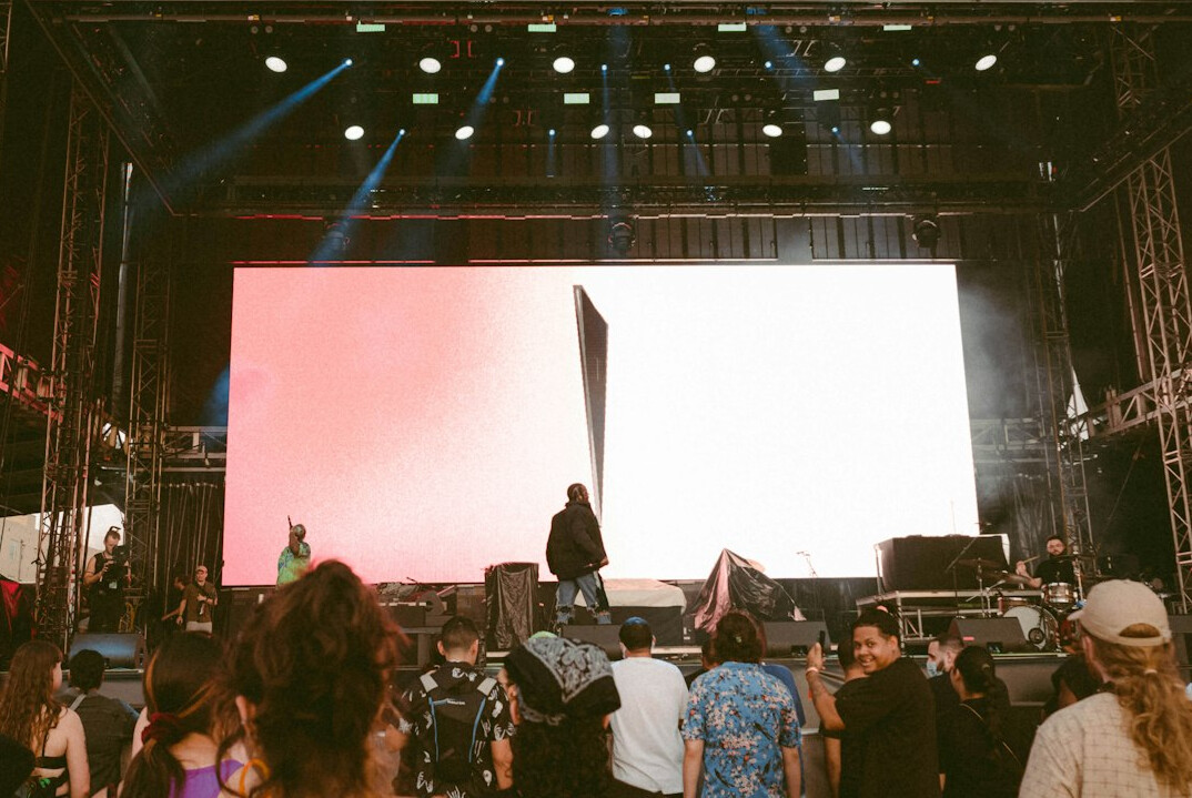 Live event stage with audience and screens