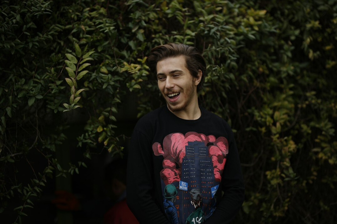 Portrait of a smiling man in a dark jumper